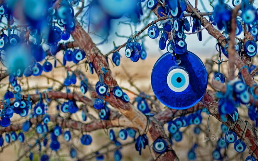 Tree decorated with amulets called nazars, Goreme National Park, Cappadocia, Turkey