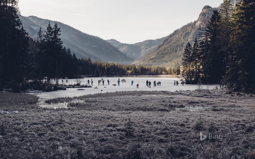 Ice skaters on Hintersee, a lake in Ramsau, Berchtesgadener Land, Bavaria, Germany